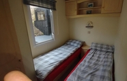 Bedroom 6 Charming 3-bed Caravan Cymtydu