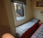 Bedroom 6 Charming 3-bed Caravan Cymtydu