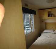 Bedroom 5 Charming 3-bed Caravan Cymtydu