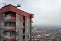 Bangunan Cozy And High Floor Studio Room At Vida View Makassar Apartment