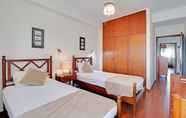 Kamar Tidur 4 Faro Classic Apartment by Homing