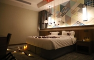 Bilik Tidur 6 Roots Hotel