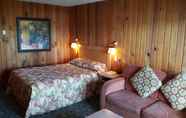 Bedroom 2 The Cedarwood Inn & Suites