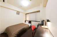 Kamar Tidur Sunny Stone Hotel II