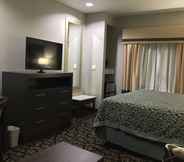 Bilik Tidur 4 Days Inn & Suites by Wyndham Houston North-Spring