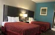 Kamar Tidur 6 Days Inn & Suites by Wyndham Houston North-Spring