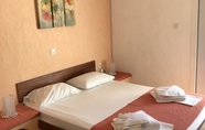 Kamar Tidur 7 Achlia Hotel