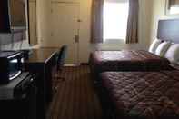 Phòng ngủ America Inn & Suites