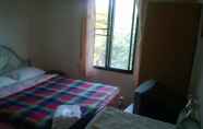 Kamar Tidur 6 Phurahong Homestay