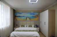 Kamar Tidur Golden Phoenix Hotel