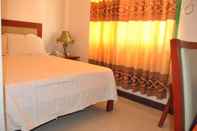 Kamar Tidur Dragon Home Inn