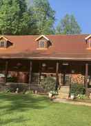 Imej utama Log Cabin in the Field