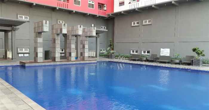 Others Homey 1BR with Spacious Living Room and Sofa Bed Green Pramuka Apartment