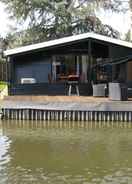 Imej utama Modern Chalet in a Small Park, Located Right Along a Fishing Pond