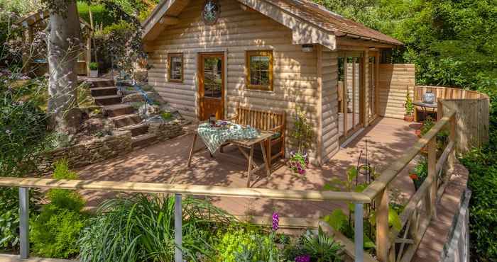 Khác Porthole Log Cabin