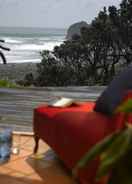 Imej utama Bethells Beach Cottages