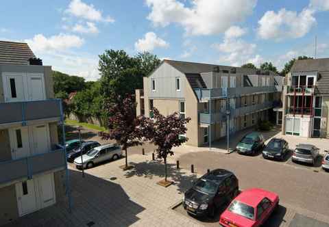 Others Well-kept Apartment, a Stone's Throw From the Sea, on Texel