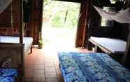 Others 3 Peaceful Homestay in the Middle of Fruit Garden - Room With Four Double Beds