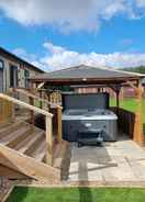 Primary image Remarkable 2-bed Luxury Lodge in Routh With Hottub