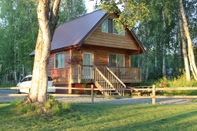 อื่นๆ Riverside Cabins