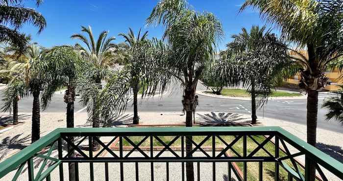 Others Tavira Palm Tree by Homing