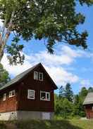 Exterior Shumarinaikohan Campground Log Cabin