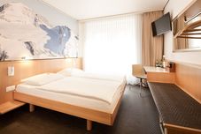 Phòng ngủ Hotel Basilea Zürich