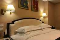 Kamar Tidur King Wing Hot Spring International Hotel