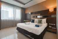 Phòng ngủ Urbanview Hotel Newton Riau Bandung by RedDoorz
