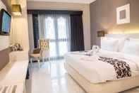 Kamar Tidur Luminor Hotel & Convention Jember By WH