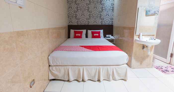 Kamar Tidur OYO 1702 Harmoni Inn Makassar