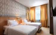 Kamar Tidur 3 Grand Impression Hotel