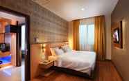 Kamar Tidur 6 Grand Impression Hotel