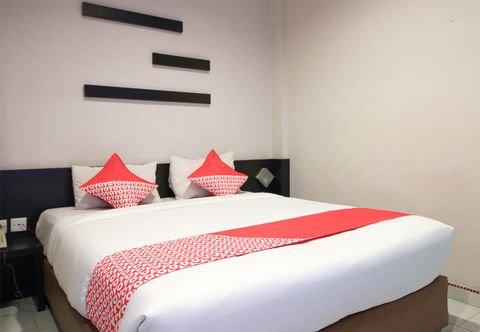 卧室 Hotel Dharma Utama Syariah