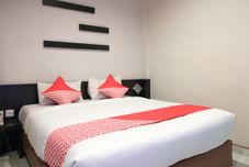 卧室 Hotel Dharma Utama Syariah