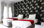 Kamar Tidur 6 The Rizen Hotel 