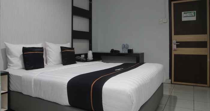 Kamar Tidur OYO 2104 Hotel Grand Sabrina