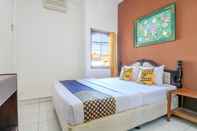 Kamar Tidur SUPER OYO 1927 Hotel Candra Adigraha