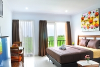 ห้องนอน Villa Tangtu Beach Inn