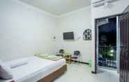 Kamar Tidur 5 Palm Garden Guesthouse Samarinda