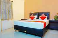 Kamar Tidur Capital O 91565 Hotel Grand Populer