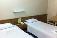 Kamar Tidur Aster Harmony Hotel Bandung