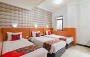 Kamar Tidur 3 Cihampelas Hotel 2 Mitra RedDoorz