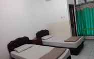 Kamar Tidur 3 Henny Executive Homestay