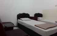 Kamar Tidur 4 Henny Executive Homestay