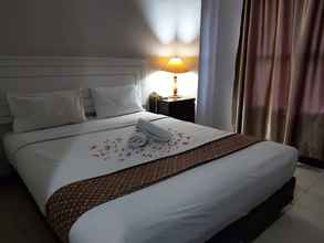 Kamar Tidur 4 Corner Palace Hotel