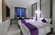 Bedroom 7 Quest Hotel Balikpapan by ASTON