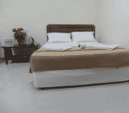 Bedroom 7 OYO 89363 Casavilla Hotel