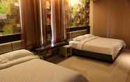 Kamar Tidur 6 de'Corner Suite Guest House