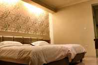 Kamar Tidur de'Corner Suite Guest House